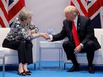 A primeira-ministra britânica Theresa May e Donald Trump