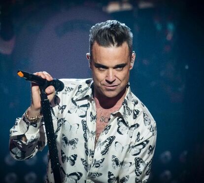 Emocionante. Robbie Williams dedica música a Diogo Jota em concerto