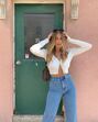 'Outfits' com casacos de malha sem nada por baixo