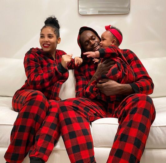Usain Bolt com a mulher, Kasi, e os filhos