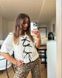 Atrevida e coquete! A blusa dos "lacinhos" que todas as mulheres querem usar nesta primavera
