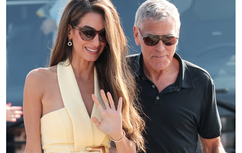 Amal e George Clooney em Veneza. Casal encanta com elegância e paixão na estreia do filme 'Jay Kelly'.
