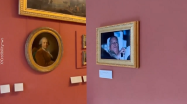 Ativistas penduram fotografia do ex-príncipe André a sair da prisão no Louvre