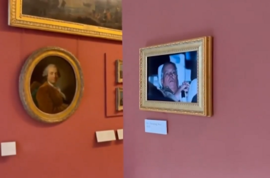 Ativistas penduram fotografia do ex-príncipe André a sair da prisão no Louvre