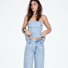 Calças com aplicações